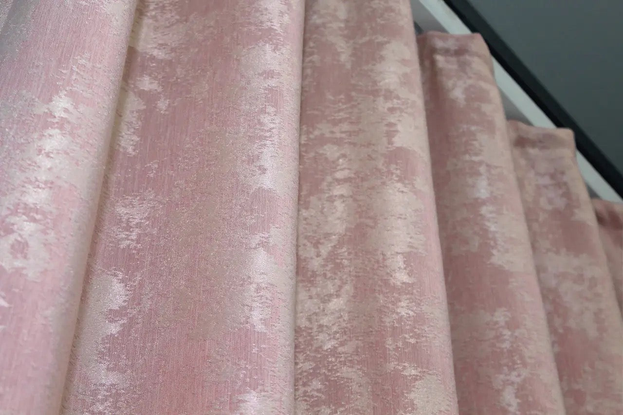 Classic pale pink curtains with a textured jacquard design, bringing warmth and elegance to your home décor.
