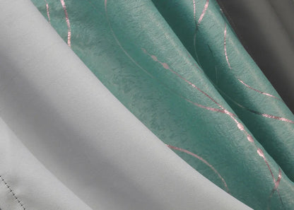 Stylish two-tone graphite & turquoise-grey blackout curtains, perfect for bringing contemporary elegance to any room.
