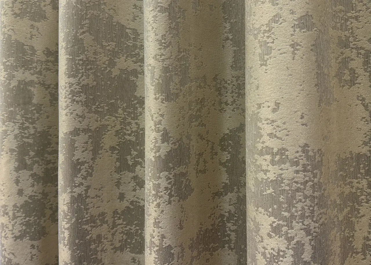 Opulent light cappuccino curtains with a subtle taupe undertone, creating a chic and inviting atmosphere.
