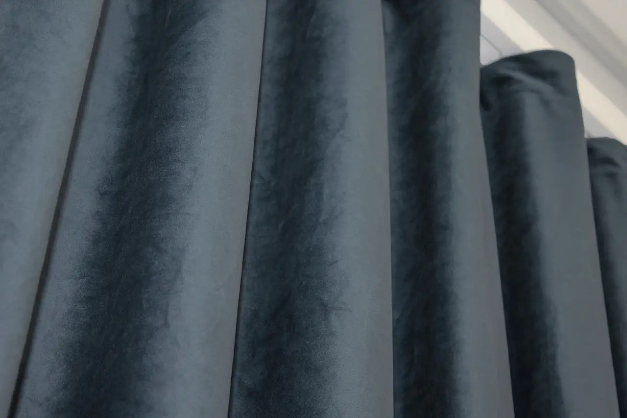 Stylish dark grey-blue velvet curtains set of 2, perfect for creating an elegant and cozy environment in your home with superior light-blocking.
