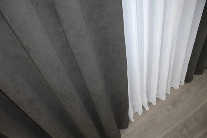 High-quality grey drapes with a subtle texture, complementing industrial and minimalist spaces.
