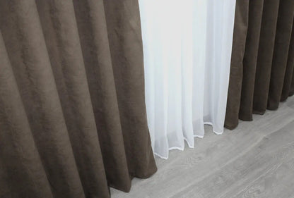 Versatile deep brown curtains, ideal for light filtering and adding depth to interior décor.
