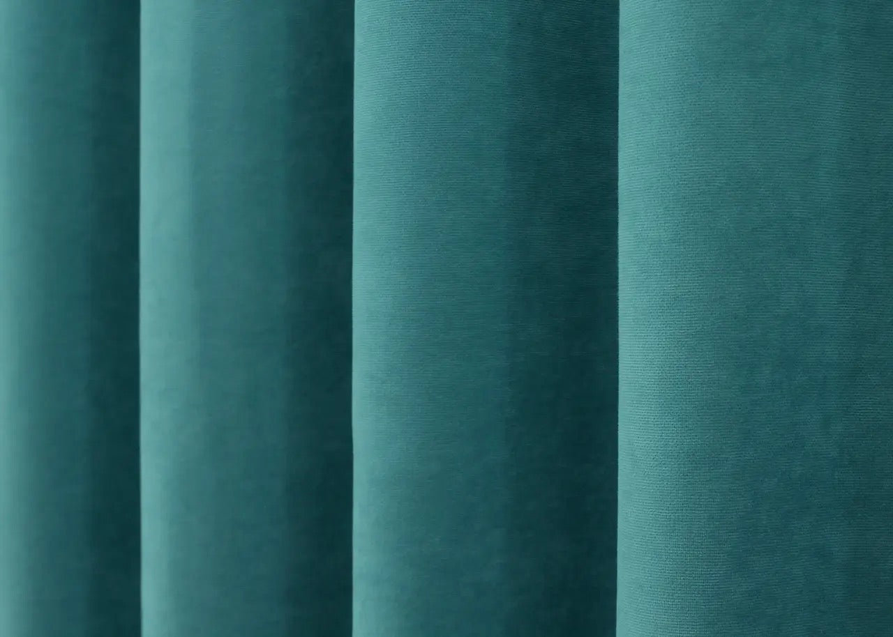 Timeless turquoise microvelvet curtains with a subtle sheen, enhancing modern home aesthetics.
