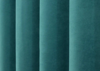 Timeless turquoise microvelvet curtains with a subtle sheen, enhancing modern home aesthetics.
