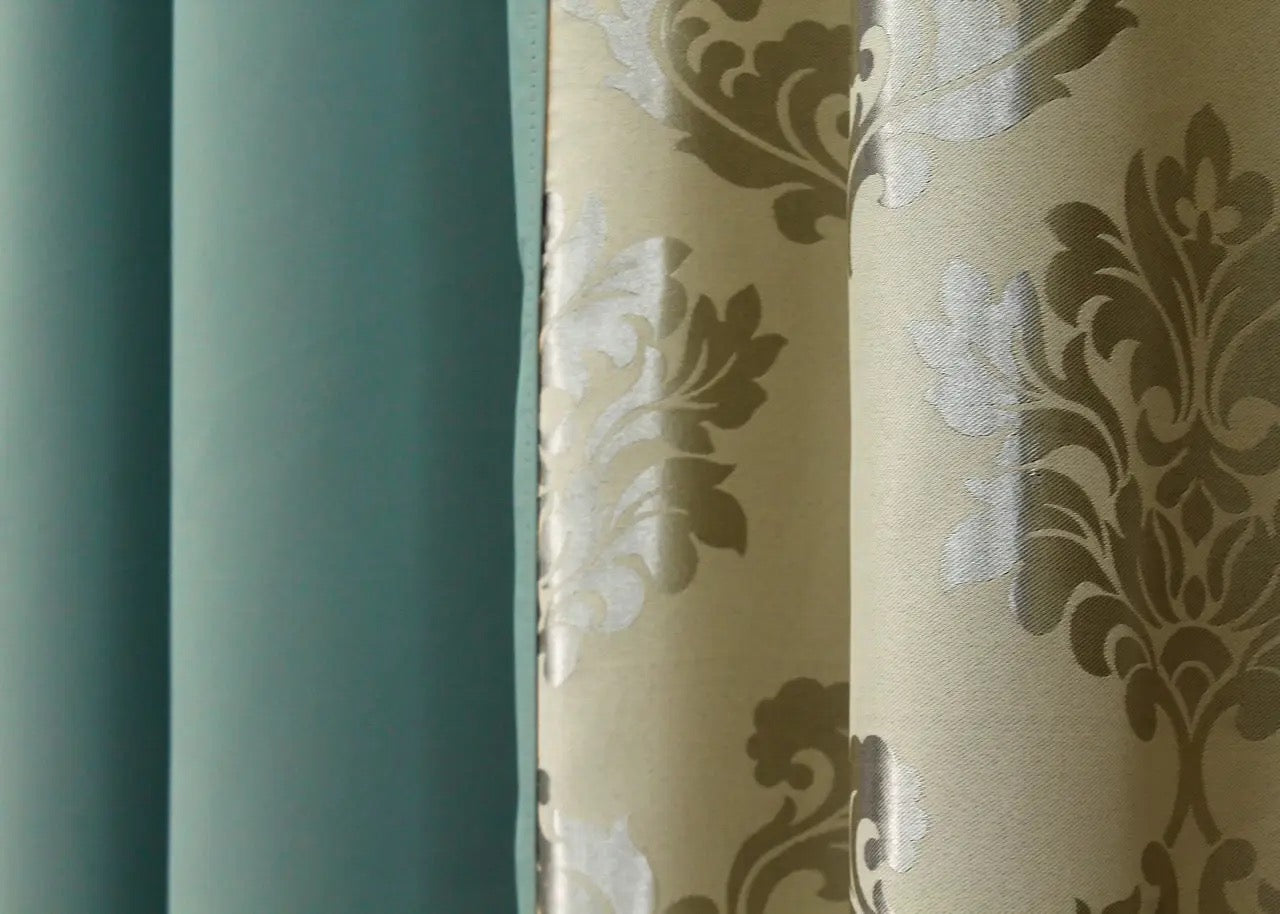 Turquoise and beige blackout curtains offering a seamless contrast that adds a touch of luxury to any room.
