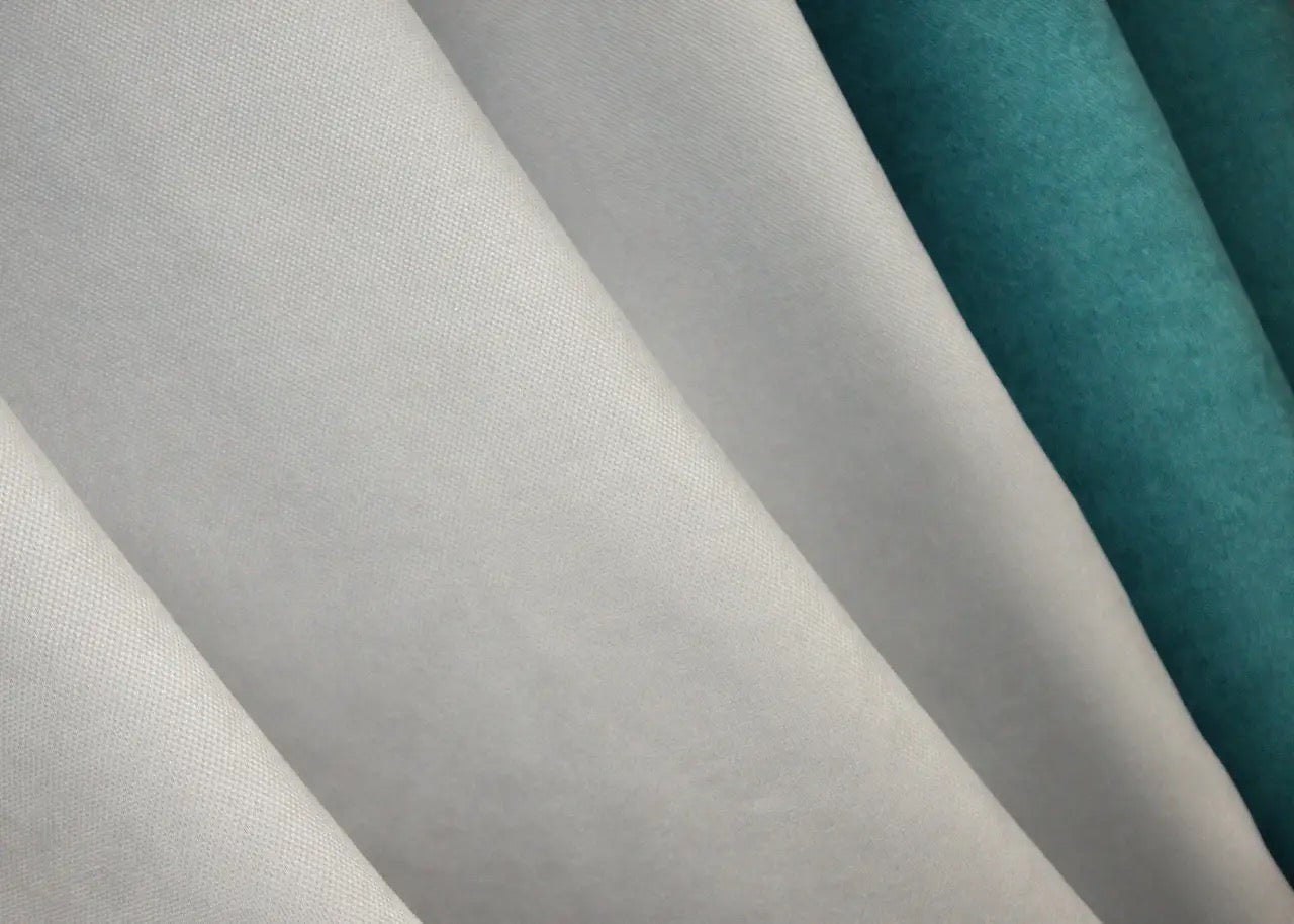 Modern and cozy turquoise and light grey combined microvelvet curtains, offering privacy and stylish decor for any contemporary home.
