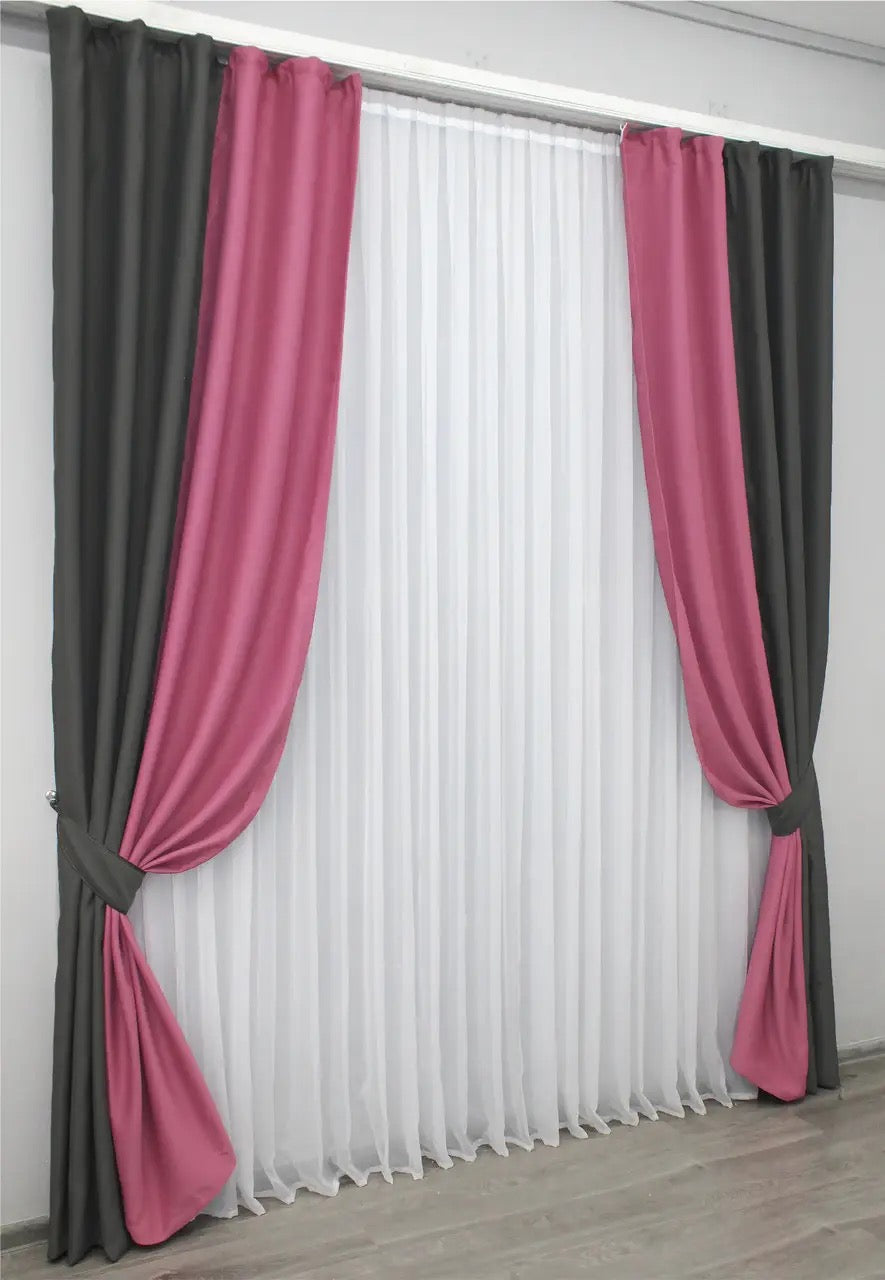 Two-tone charcoal (dark grey) and berry (raspberry, mulberry) combined blackout curtains with a plush texture for a chic and modern look.
