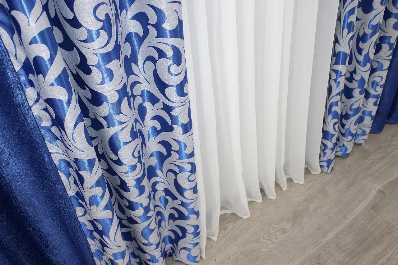 Sophisticated two-color combined curtains in rich blue and subtle grey, seamlessly blending into contemporary décor.
