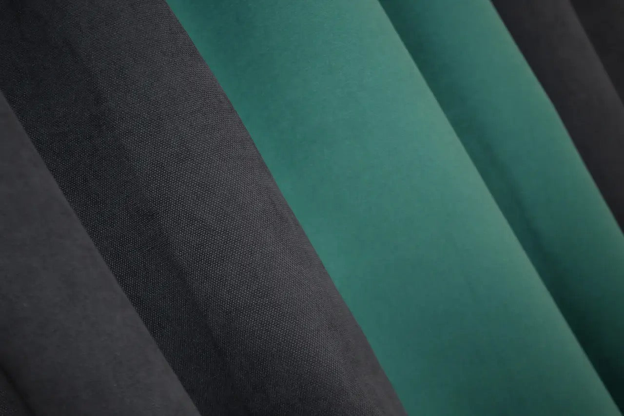 Two-tone charcoal (dark grey) and emerald (teal, aqua) combined microvelvet curtains with a plush texture for a chic and modern look.
