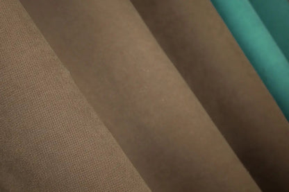 Two-tone turquoise (Teal, Aqua) and brown (Chocolate, Mocha) combined microvelvet curtains with a plush texture for a chic and modern look.
