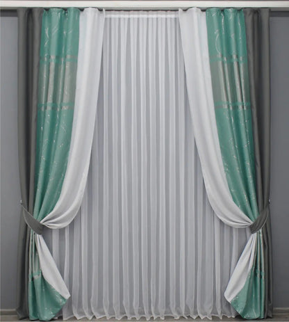 Two-tone graphite and turquoise-grey blackout curtains in a refined combination, perfect for contemporary and luxurious interiors.
