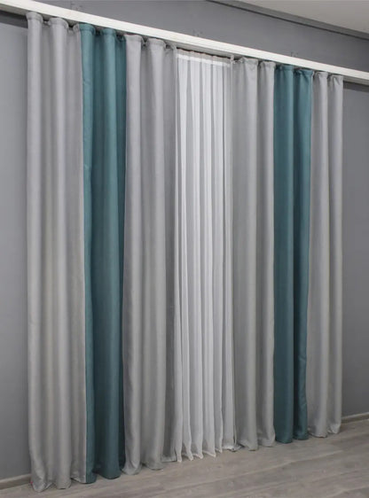 Elegant light grey and turquoise combined linen curtains, ideal for Scandinavian and coastal-inspired interiors, adding a calming and vibrant contrast.
