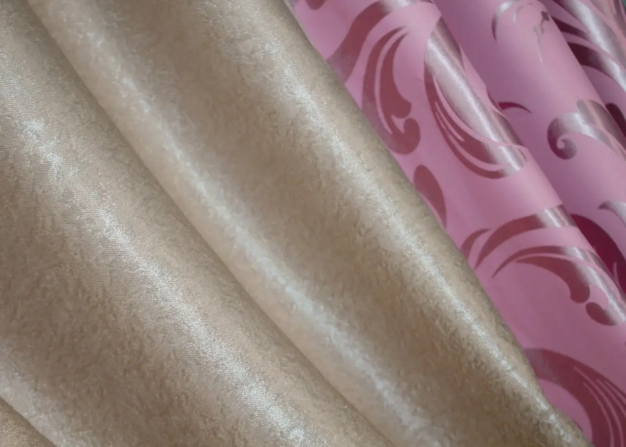 Two-tone pink and beige blackout curtains offering a sophisticated soft look, perfect for modern and classic interiors.
