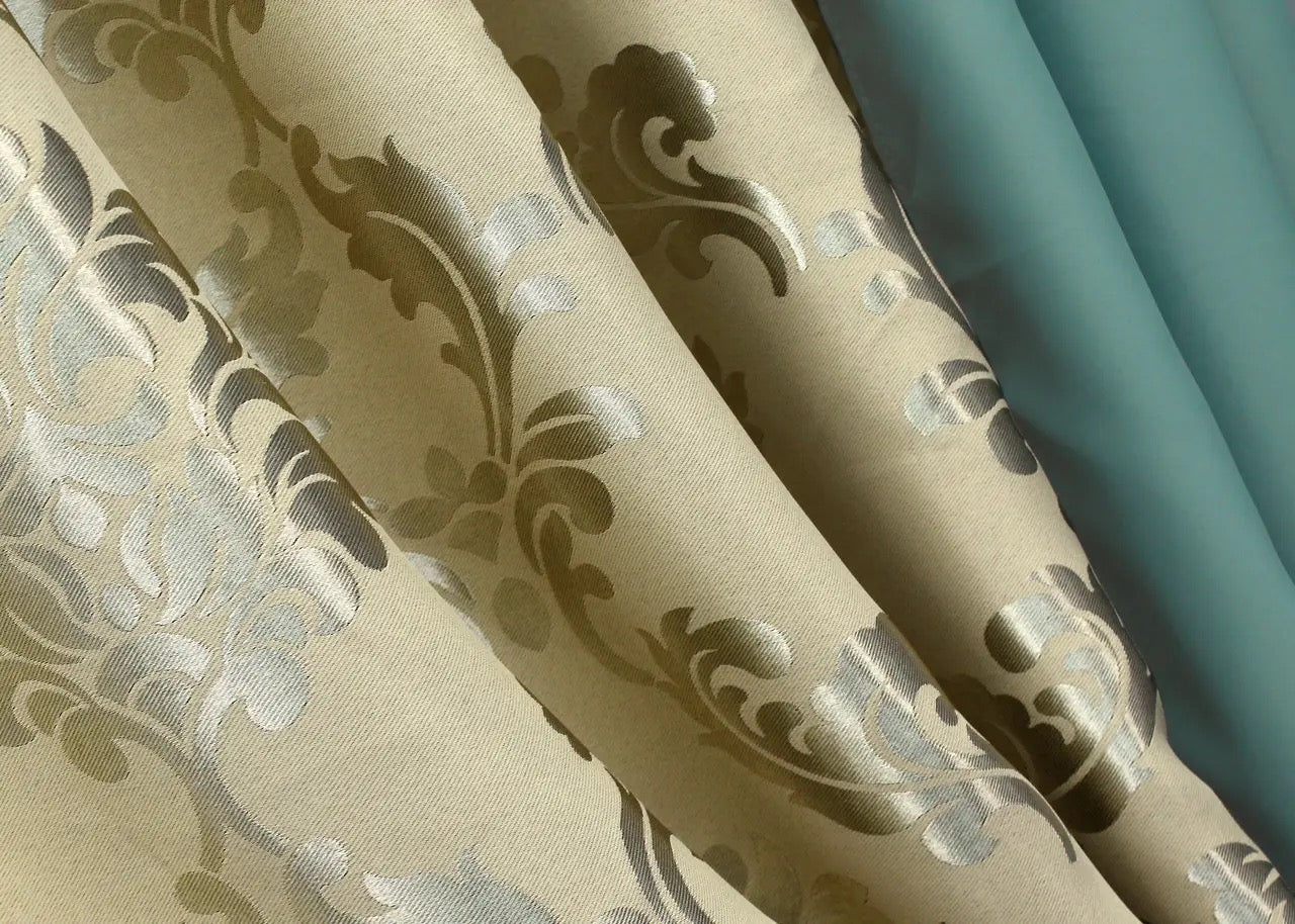 Stylish turquoise and beige blackout curtains, ideal for enhancing living rooms, bedrooms, and offices with a refined design.
