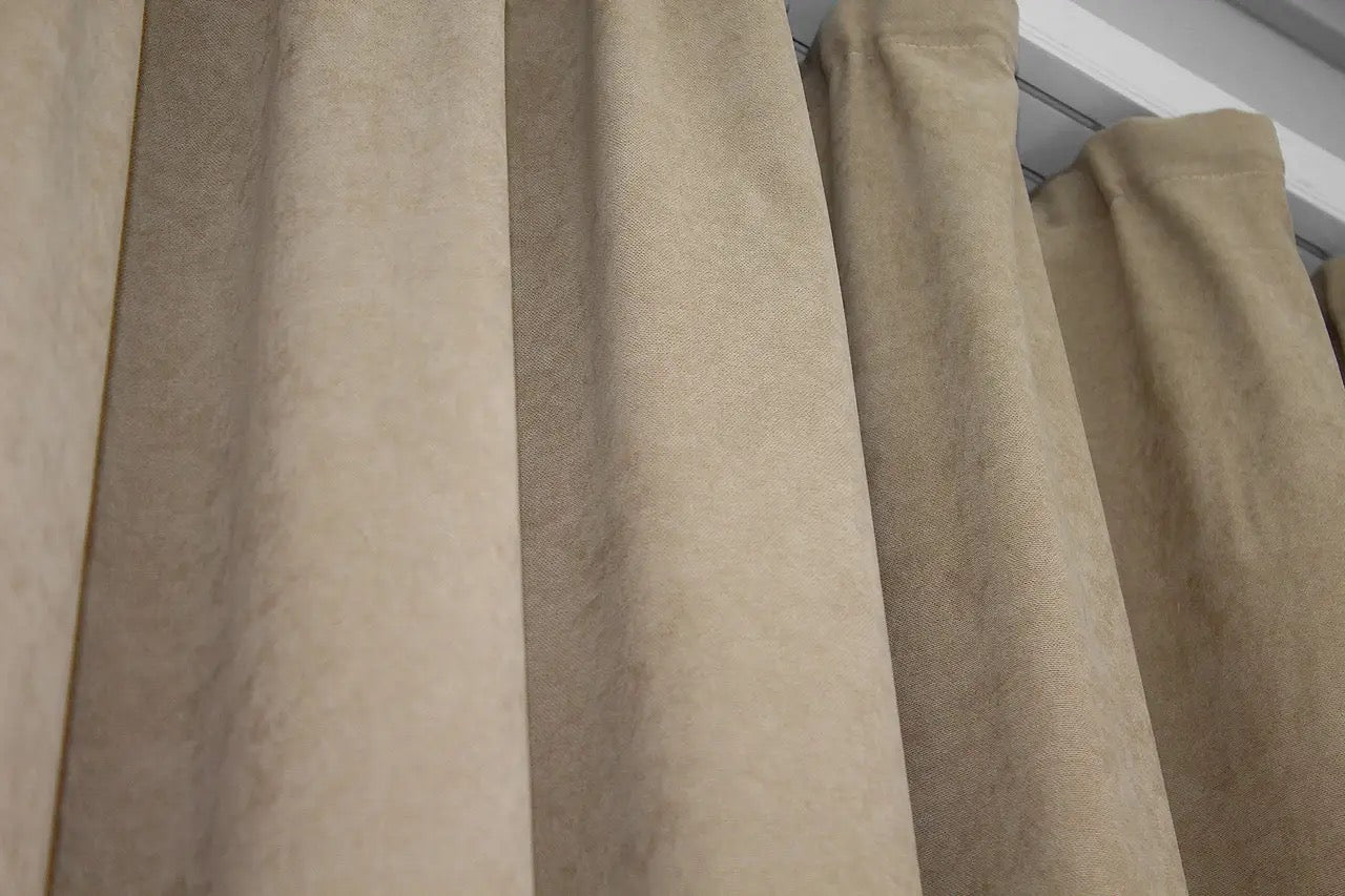 Neutral-toned beige velvet drapes with premium fabric for a sophisticated ambiance.
