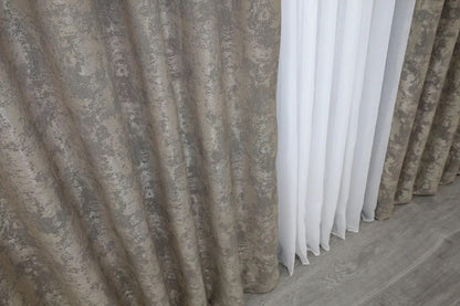 Luxurious beige-grey curtains with a calming tone, blending seamlessly into modern and classic room décors.
