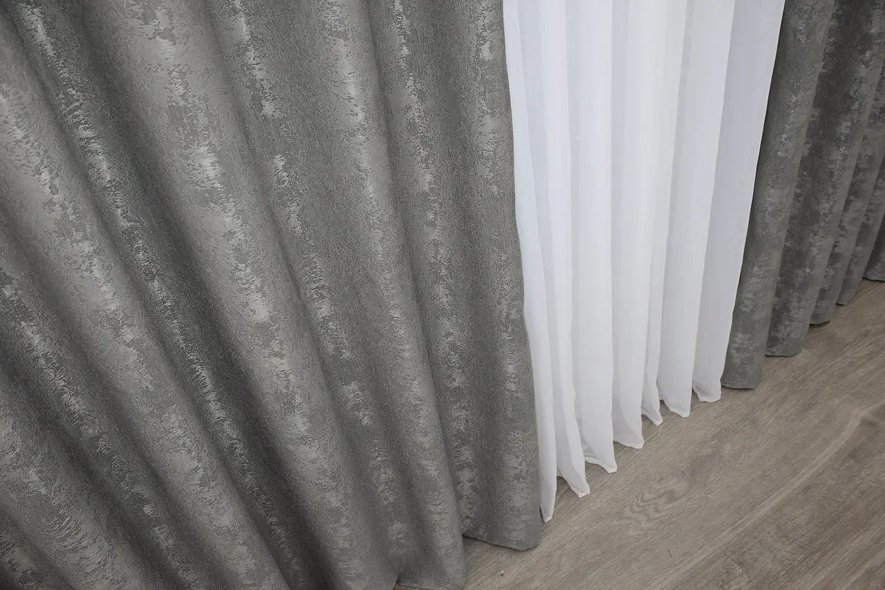 Versatile grey curtains with a timeless tone, seamlessly blending into contemporary and classic décor styles.
