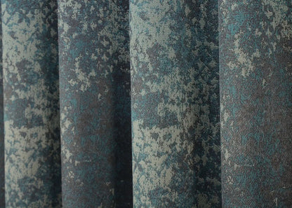 Sophisticated linen curtains in deep teal and charcoal grey, enhancing industrial and contemporary décor.
