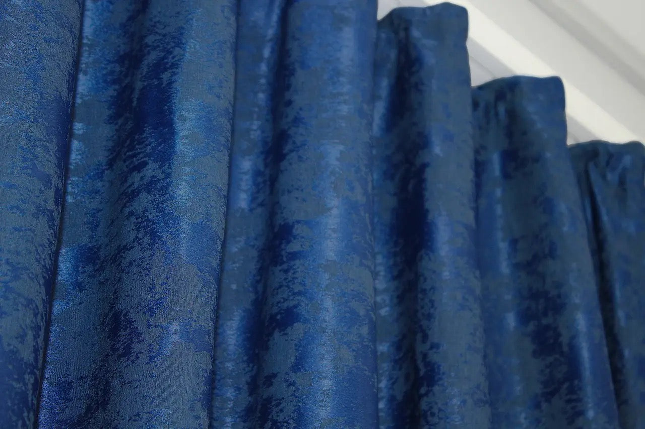 Semi-blackout Ocean Blue jacquard curtains that filter natural light while enhancing the aesthetics of any room.
