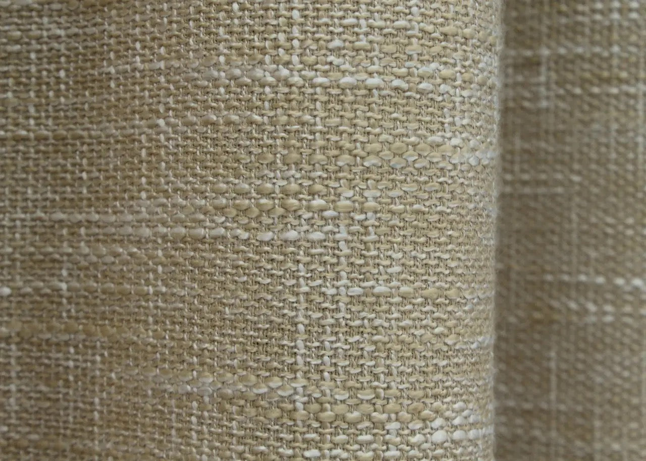 Warm beige coarse-woven linen curtains, designed to add depth and texture to elegant living spaces.
