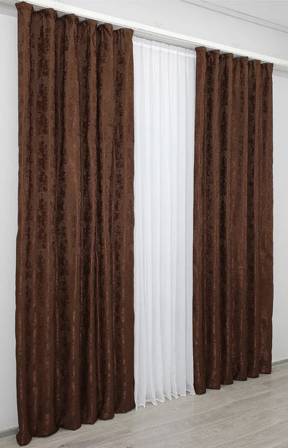 Warm brown-burgundy curtains with a rich, sophisticated tone, blending seamlessly into contemporary and traditional interior designs.
