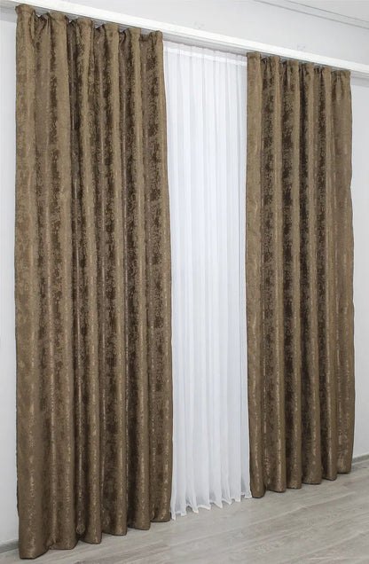 Warm brown curtains with a sophisticated tone, blending seamlessly into contemporary and classic interior designs.
