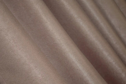 Warm sand velvet blackout drapes with a timeless, rich color, adding warmth and luxury to any home.
