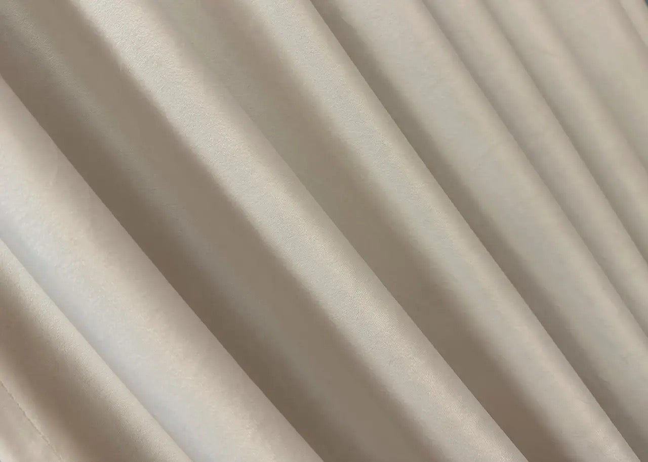 Warm taupe velvet blackout drapes, ideal for luxurious and stylish window treatments.
