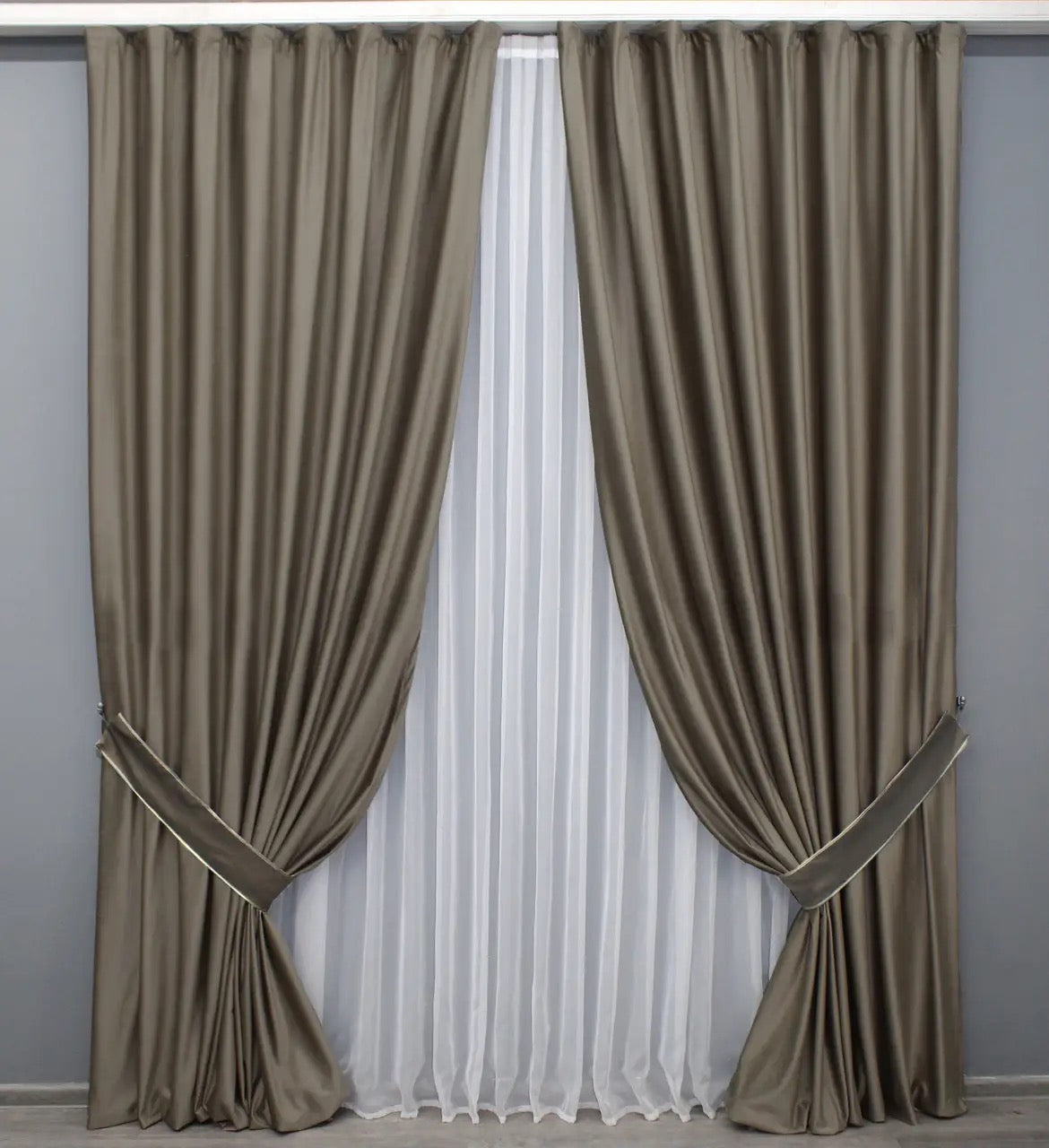 Elegant warm taupe velvet drapes with thick, high-quality fabric, designed for a sophisticated home ambiance.
