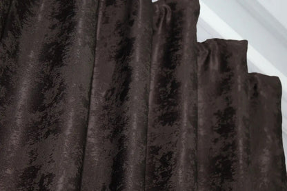 Close-up of wenge jacquard curtains showcasing luxurious woven texture and detailed craftsmanship.
