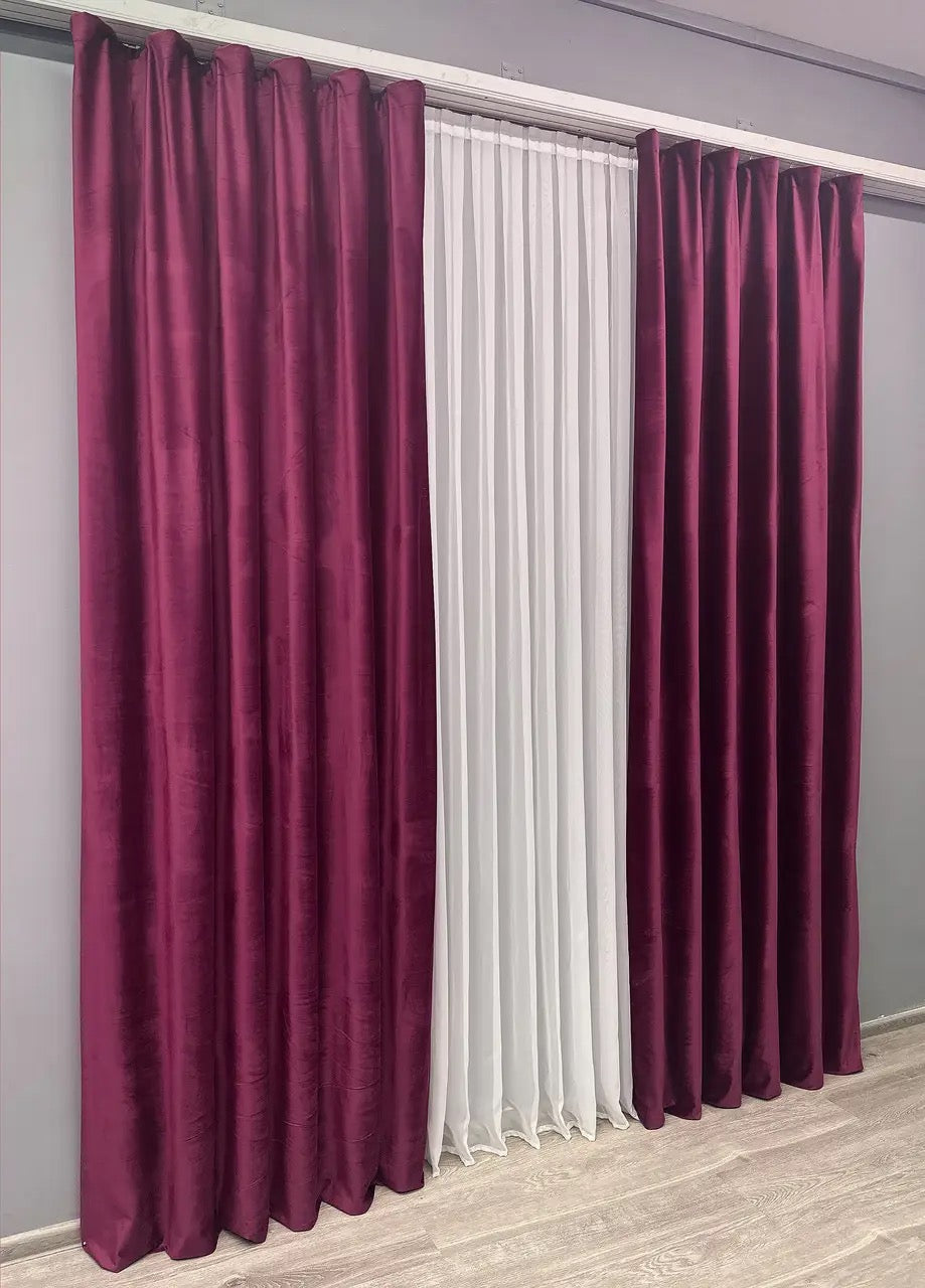 Wine red premium velvet curtains with plush texture, perfect for reducing glare and enhancing privacy.
